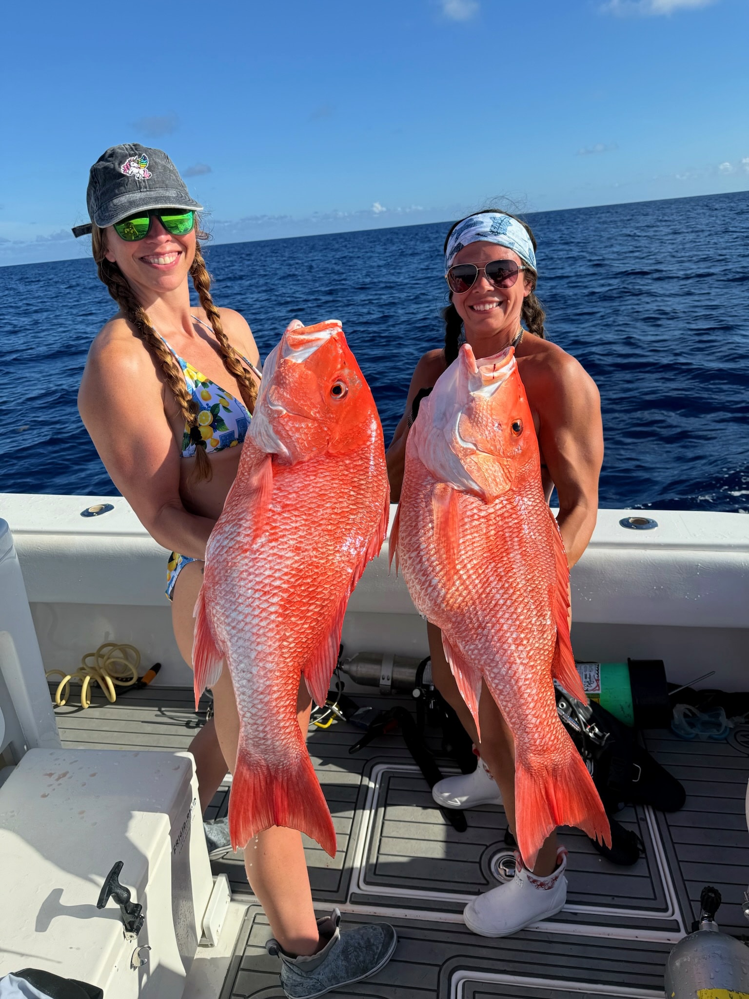 Two anglers with a pair of big red snapper