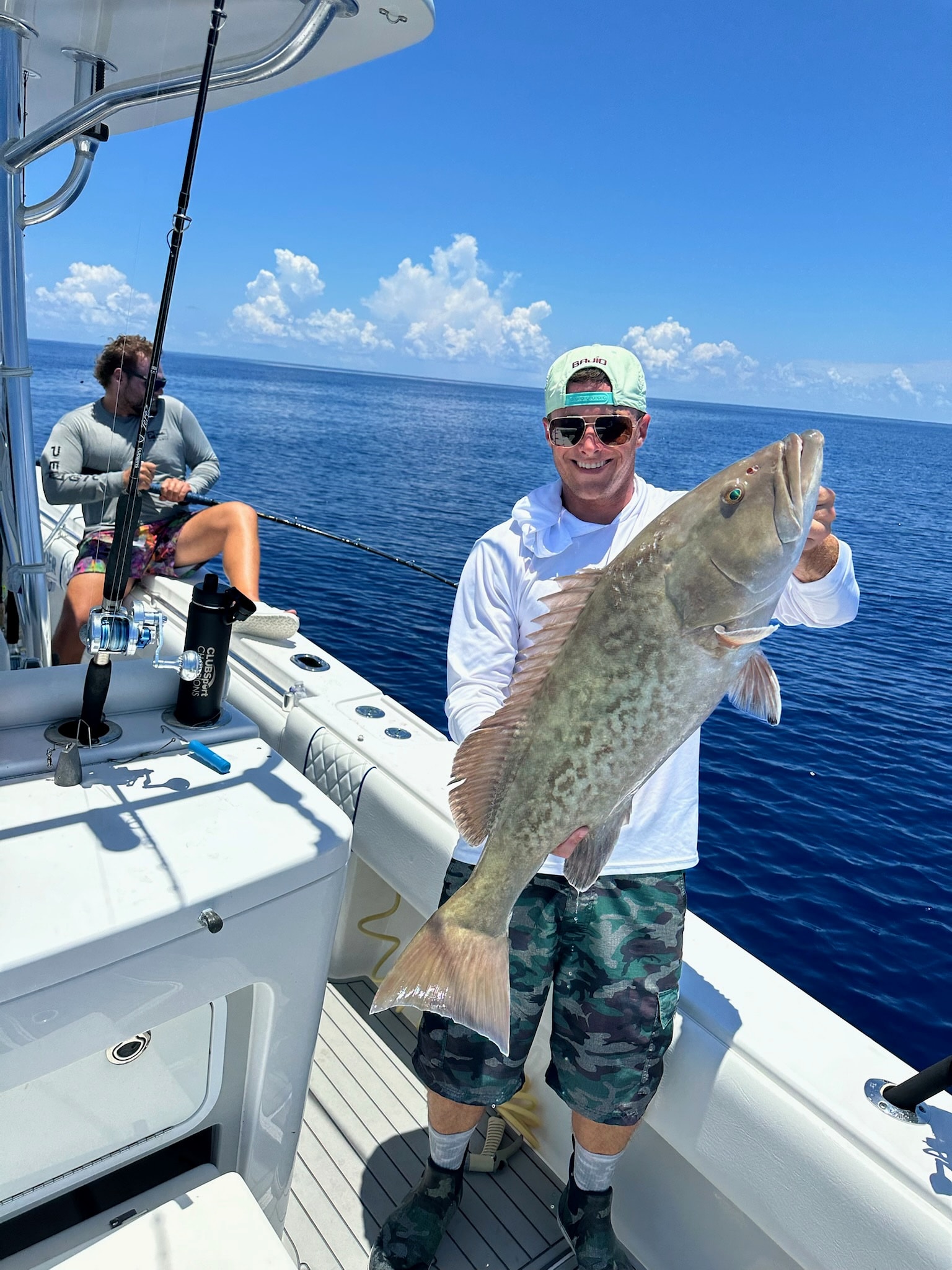 Grouper aboard while the next rod is still bent