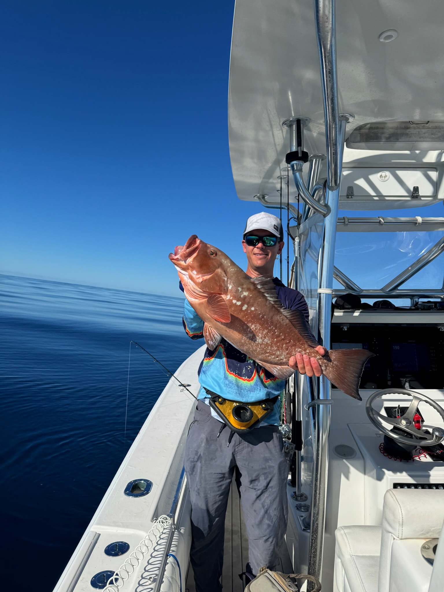 A red grouper at the console